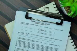Concept of SBA Form Early Stage Current Pay Debenture Opinion of Counsel isolated on Wooden Table. photo