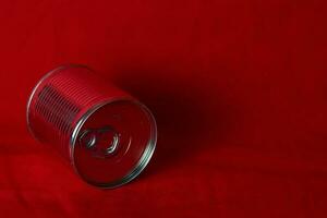 close up milk cans rolling in red background photo