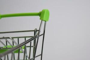 Close up shopping cart, shopping trolley isolated on white background photo