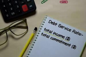 Debt Service Ratio write on a book isolated on Office Desk. Home loan concept photo