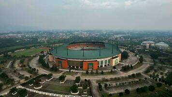 Aerial view of the Beautiful scenery of Pakansari Stadium. with Bogor cityscape background. Bogor, Indonesia, July 6, 2022 photo