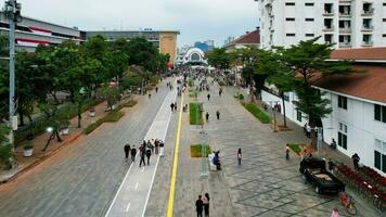 Aerial view of Jakarta Kota Train Station with Jakarta cityscape background. Jakarta, Indonesia, August 30, 2022 photo