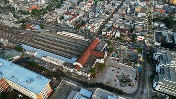 Aerial view of Jakarta Kota Train Station with Jakarta cityscape background. Jakarta, Indonesia, August 30, 2022 photo