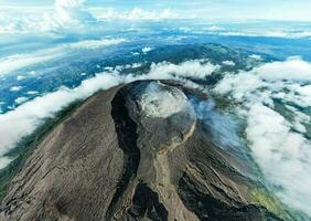 Aerial view of Mount Slamet or Gunung Slamet is an active stratovolcano in the Purbalingga Regency. Central Java, Indonesia. December 13, 2022 photo