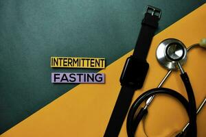 Intermittent Fasting text on top view color table and Healthcare medical concept. photo
