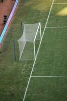 Soccer goalposts at sports Jakarta International Stadium on sunny day. Jakarta, Indonesia, August 1, 2022 photo