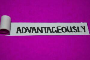 Advantageously text, Inspiration and positive vibes concept on purple torn paper photo