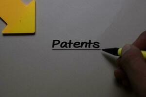 Patents write on a paperwork isolated on office desk. photo