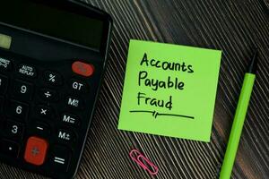 Accounts Payable Fraud write on sticky notes isolated on office desk. photo