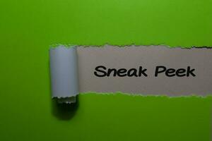 Close up text Sneak Peek write on green torn paper photo