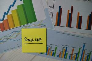 Small Cap write on sticky notes isolated on Office Desk. Stock market concept photo
