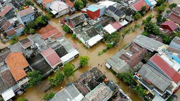 Aerial POV view Depiction of flooding. devastation wrought after massive natural disasters at Bekasi - Indonesia photo