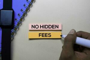 No Hidden Fees text on sticky notes isolated on office desk photo