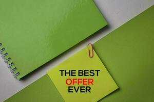 The Best Offer Ever text on top view office desk table of Business workplace and business objects. photo