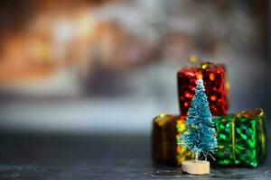 Close up decoration christmas tree and christmas gifts isolated on bokeh background photo