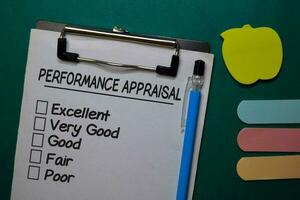 Performance Appraisal write on a paperwork isolated on Office Desk photo