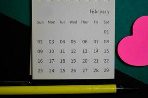 Top view February monthly Calendar isolated on office desk photo