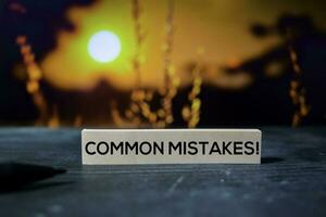 Common Mistakes on the sticky notes with bokeh background photo