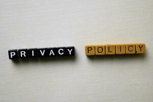 Privacy Policy on wooden blocks. Business and inspiration conceptp photo