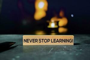 Never Stop Learning on the sticky notes with bokeh background photo