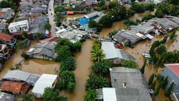 Aerial POV view Depiction of flooding. devastation wrought after massive natural disasters at Bekasi - Indonesia photo