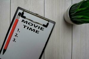 Movie Time and List Number write on a paperwork isolated on office desk. photo