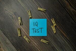 IQ Test write on sticky notes isolated on office desk. photo