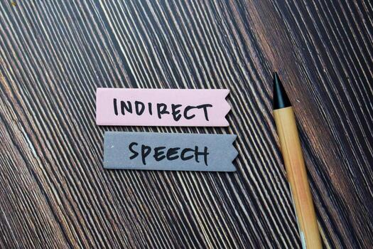 Indirect Speech write on sticky notes isolated on office desk. photo