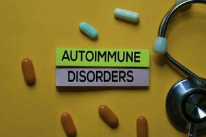 Autoimmune Disorders text on sticky notes. Office desk background. Medical or Healthcare concept photo