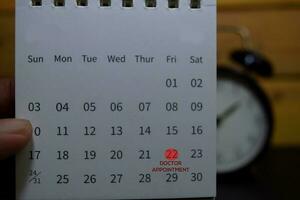 Appointment Dentist write on calendar. Date 22. Reminder or Schedule Concepts photo