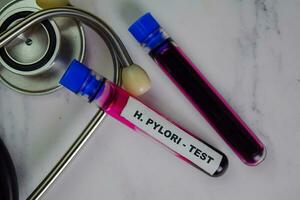 H. Pylori - Test with blood sample. Top view isolated on office desk. Healthcare or Medical concept photo