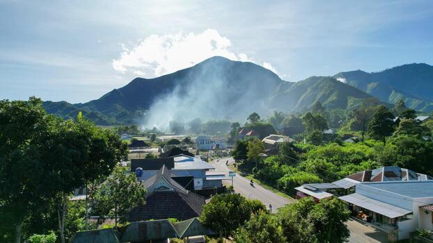 Aerial view of some agricultural fields in Sembalun. Sembalun is situated on the slope of mount Rinjani and is surrounded by beautiful green mountains. Lombok, Indonesia, March 22, 2022 photo