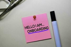 Hello I am Onboarding text on sticky notes isolated on office desk photo