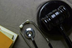 Black Judges gavel and stethoscope. Healthcare or Medical jurisprudence. Medical Law photo