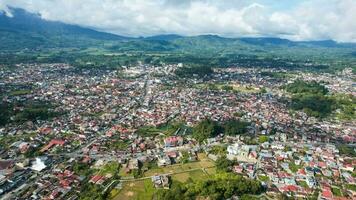 Aerial view of Traditional Minangkabau houses located in Bukittinggi, West Sumatra, Indonesia. Bukittinggi, Indonesia - January 25, 2023 photo