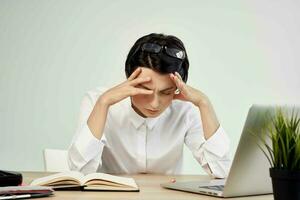 Businesswoman at the desk with glasses self-confidence Studio Lifestyle photo