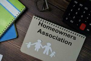 Homeowners Association text write on a book isolated wooden table. photo