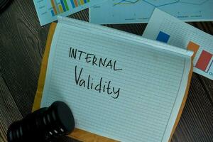 Internal Validity write on a book isolated on office desk. photo