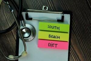 South Beach Diet on top view Wooden Table and Healthcare medical concept. photo