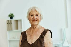 patient with a plaster on his arm covid passport immunization safety photo