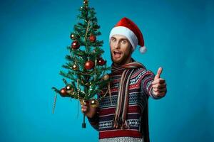 Cheerful man in a santa hat holding a banner holiday studio posing photo