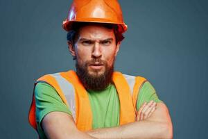 Cropped view of bearded man in working uniform construction engineer photo