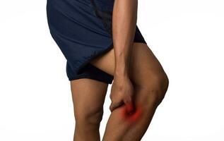 Man calf pain with an anatomy injury caused by sports accident or arthritis. Massaging painful leg calf. Joint injury or disease concept photo