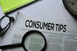 Consumer Tips text in headline isolated on white background. Newspaper concept photo