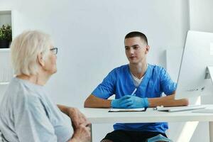 old woman talking to the doctor health and medicine photo