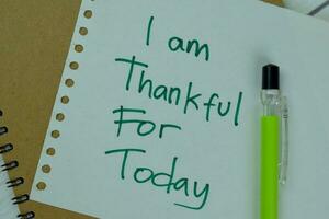 Concept of I am Thankful For Today write on sticky notes isolated on Wooden Table. photo