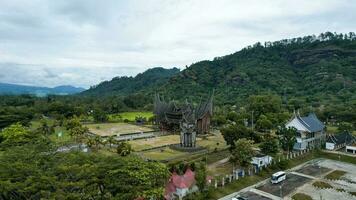 Aerial view of Istano Baso Pagar Ruyung, a heritage building with traditional Minangkabau design at Tanah Datar. Rumah Gadang Istana Basa Pagaruyung. West Sumatra, Indonesia, January 25, 2023 photo