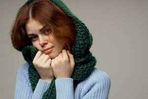 red-haired woman green scarf on the head isolated background photo