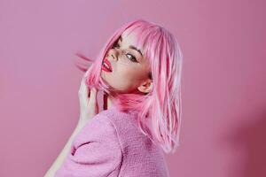 Pretty young female attractive look pink wig stylish clothes pink background unaltered photo