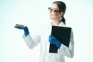 Woman in White Coat Biology Research Professional photo